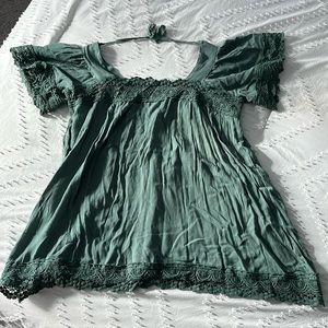 Boutique green top with lace and upper back tie.